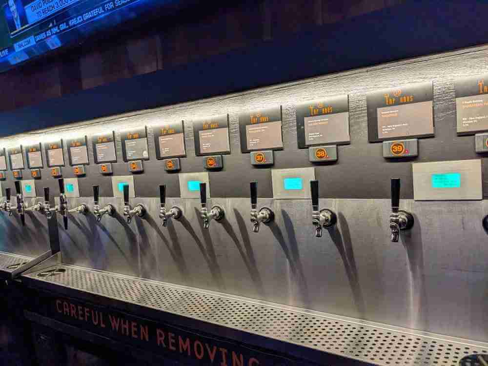 a row of taps on a wall 